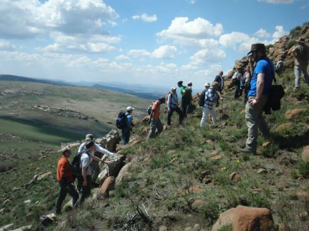 Group hiking up a steep slope. Picture courtesy of Ben Maton. 