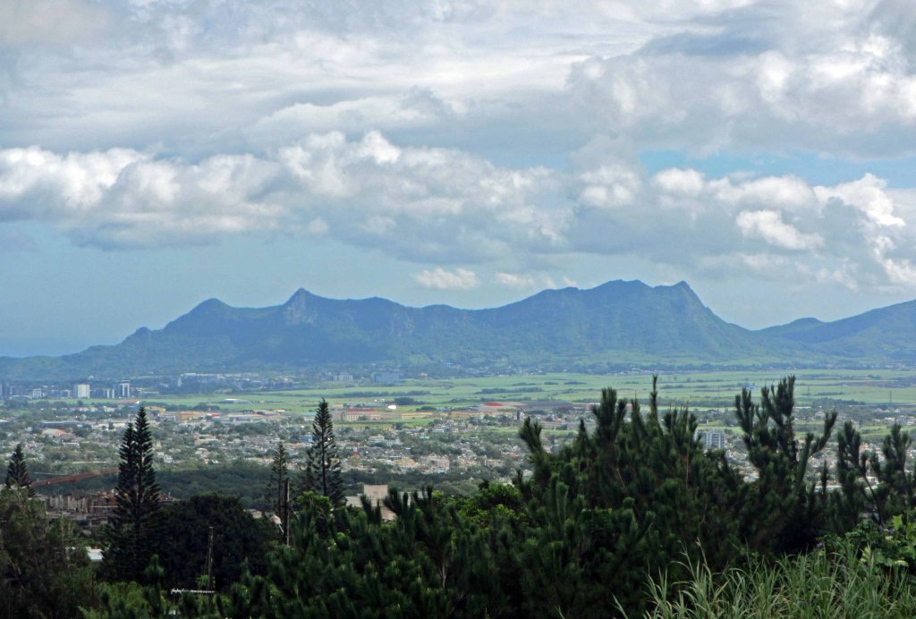 Vegetation, valley, mountains, sky. 