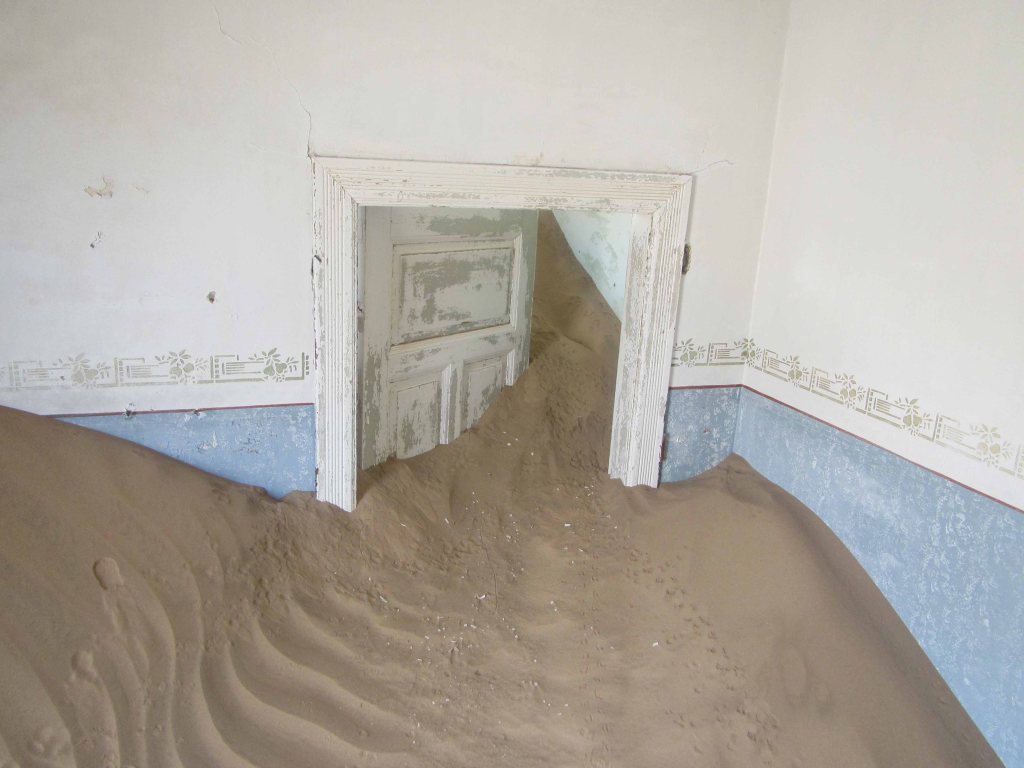 A sand-filled building in Kolmanskop, Namibia. 