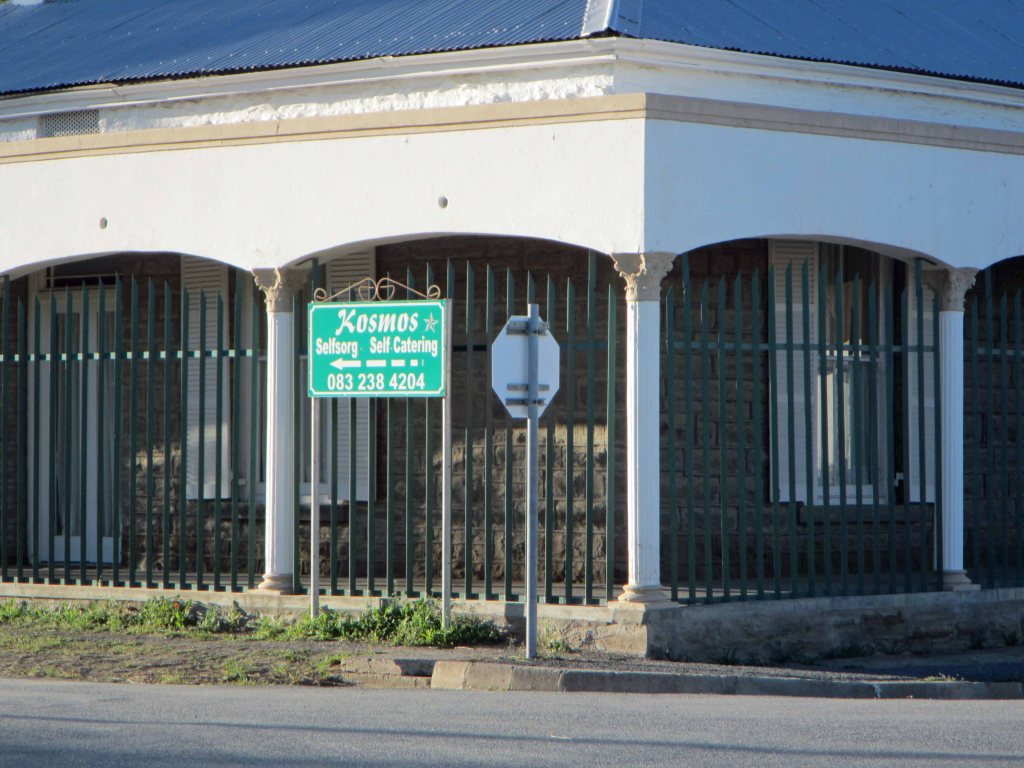A sign for the Kosmos Guesthouse. "Kosmos" is Afrikaans for "Cosmos".  